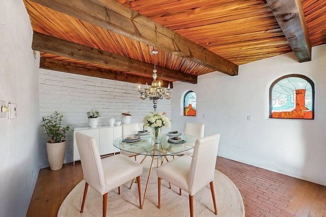 dining space with beamed ceiling, hardwood / wood-style flooring, a notable chandelier, and wood ceiling