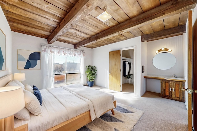 carpeted bedroom with beam ceiling and wood ceiling