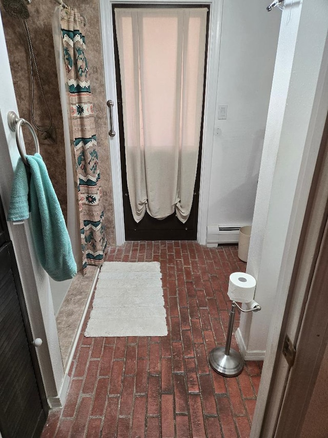 bathroom with baseboard heating