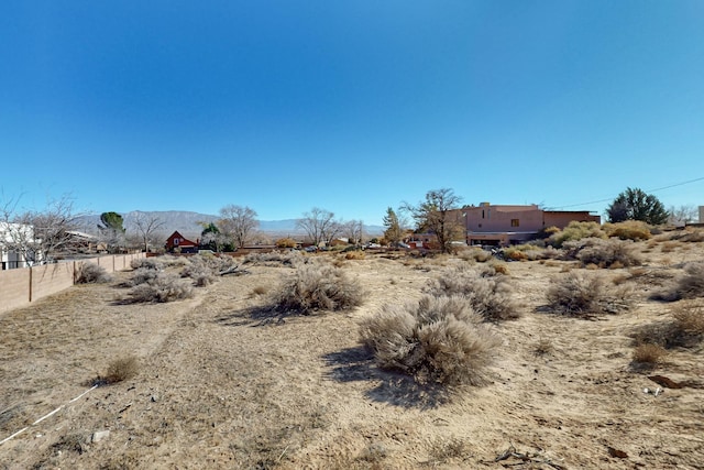 view of yard with a mountain view and a rural view