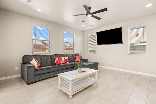 living room with ceiling fan and light tile patterned floors