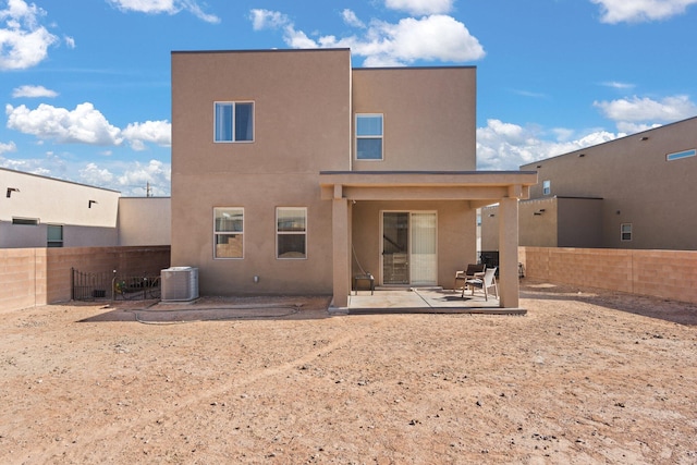 back of house featuring a patio and central air condition unit