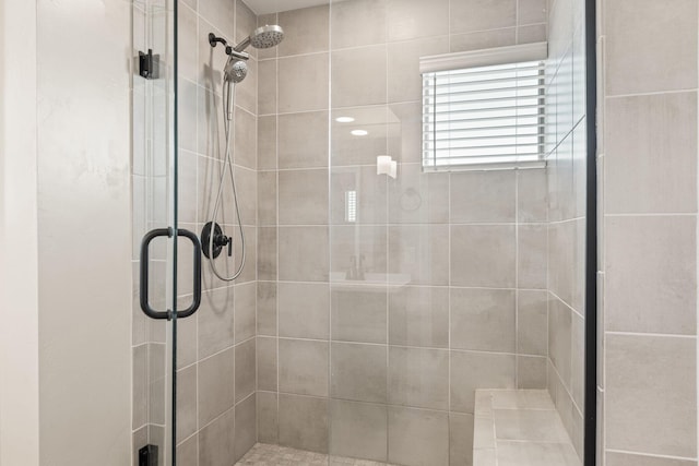 bathroom with a shower with shower door