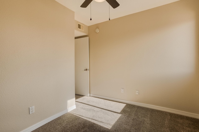 unfurnished room with carpet and ceiling fan