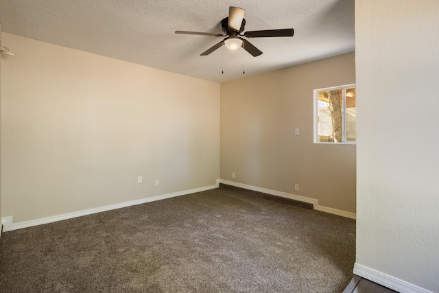 carpeted empty room with a textured ceiling and ceiling fan