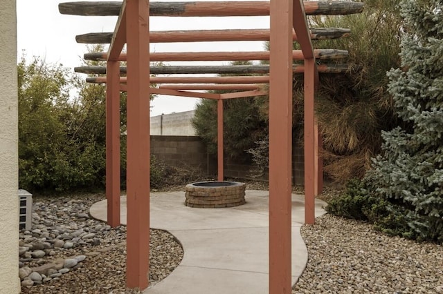 view of patio / terrace with an outdoor fire pit