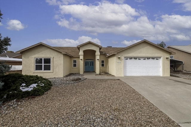 ranch-style house featuring a garage