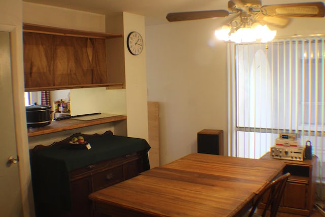 dining space featuring ceiling fan