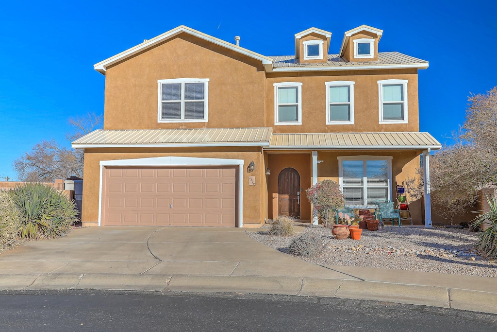 view of front of home featuring a garage and covered porch