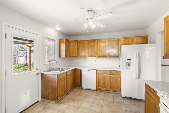 kitchen with ceiling fan, white appliances, sink, and light tile patterned floors