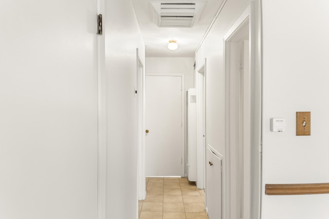 hallway with light tile patterned floors