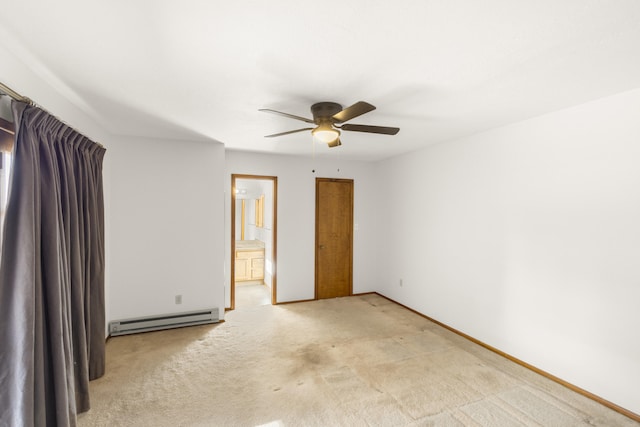 carpeted empty room with ceiling fan and a baseboard heating unit