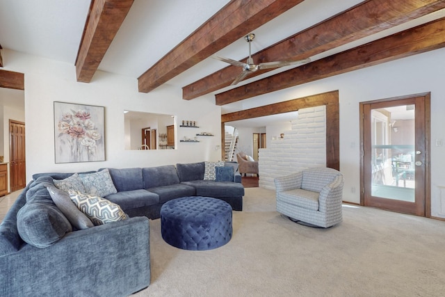 living room with beam ceiling, ceiling fan, and light carpet