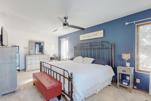 bedroom featuring ceiling fan and light colored carpet