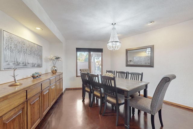 dining area featuring a chandelier