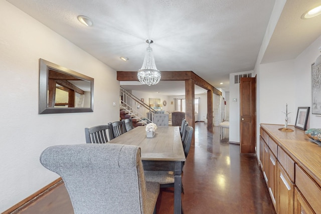 dining space featuring a chandelier