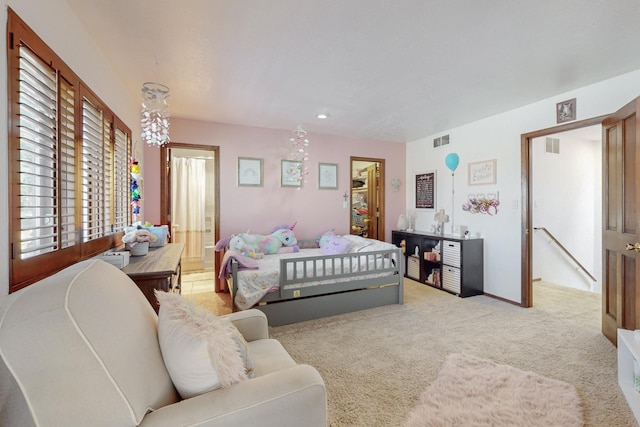 bedroom with light colored carpet