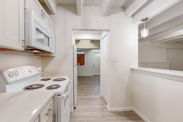 kitchen featuring white cabinetry, decorative light fixtures, white appliances, and light hardwood / wood-style floors