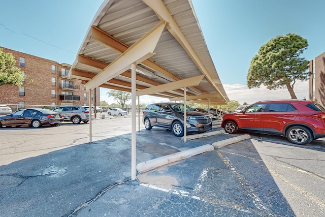 view of parking / parking lot with a carport