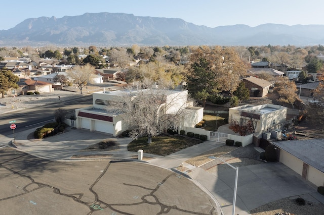 birds eye view of property featuring a mountain view