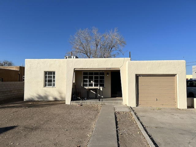 southwest-style home featuring a garage