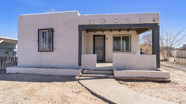 adobe home with covered porch