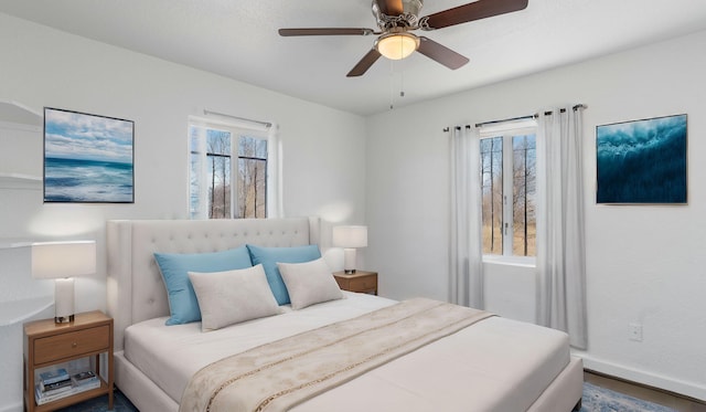 bedroom with ceiling fan and wood-type flooring