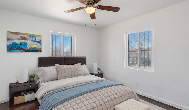 bedroom with hardwood / wood-style floors and ceiling fan