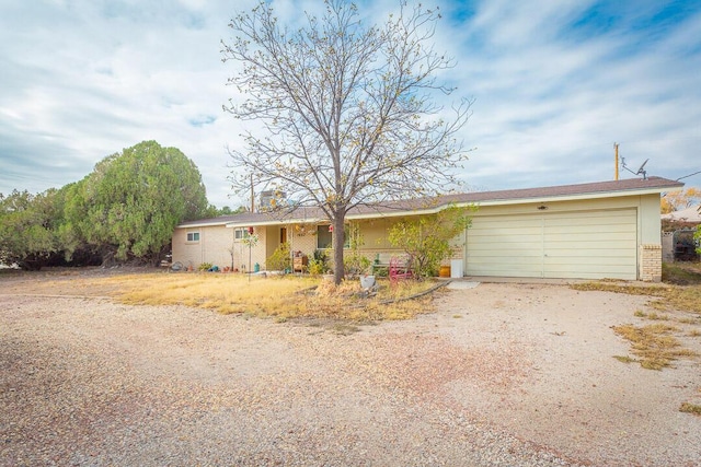 ranch-style house featuring a garage