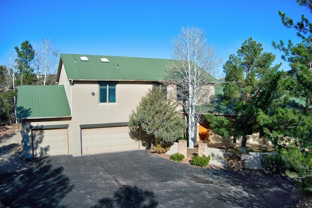 view of front of home with a garage