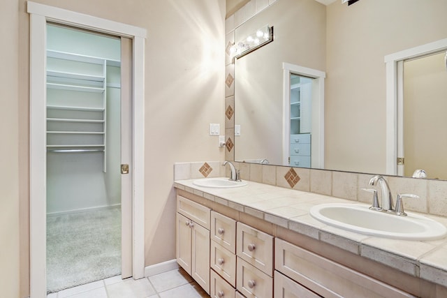 bathroom featuring tile patterned flooring and vanity