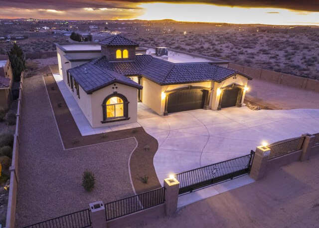 mediterranean / spanish-style home featuring a garage