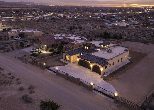 mediterranean / spanish-style house with a garage