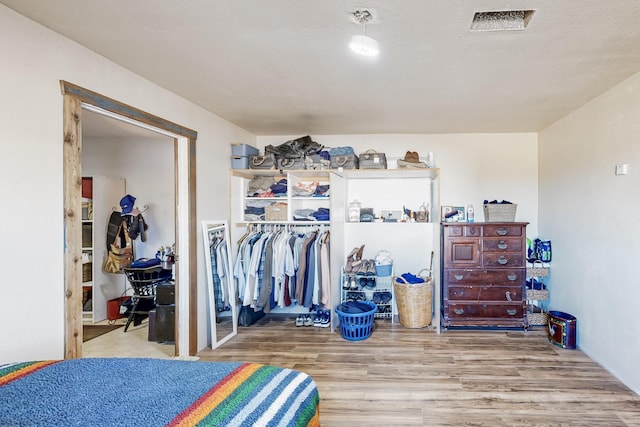 6284 State Highway 55, Mountainair, NM 87036 - bedroom featuring wood finished floors and a closet