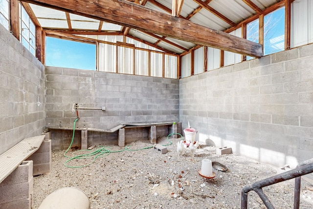 6284 State Highway 55, Mountainair, NM 87036 - miscellaneous room with vaulted ceiling and concrete block wall