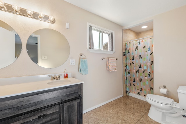 bathroom with curtained shower, tile patterned flooring, vanity, and toilet