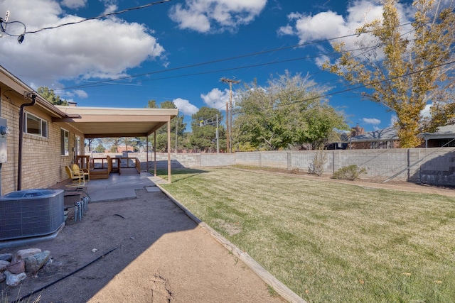 view of yard featuring central air condition unit and a patio