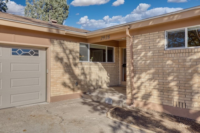 view of exterior entry featuring a garage