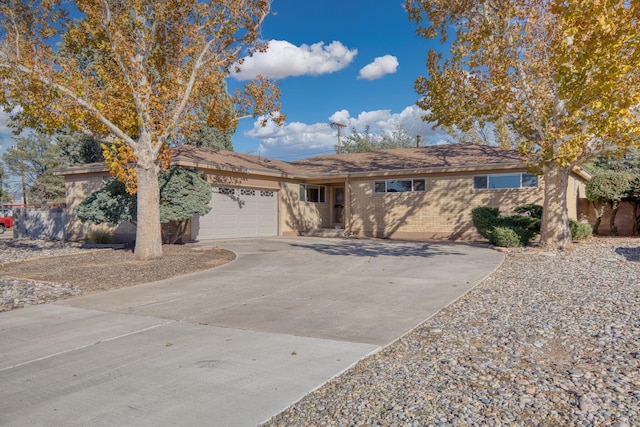 ranch-style house featuring a garage