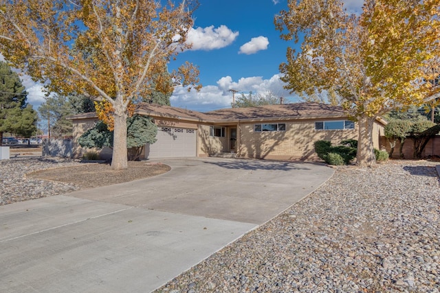 single story home featuring a garage