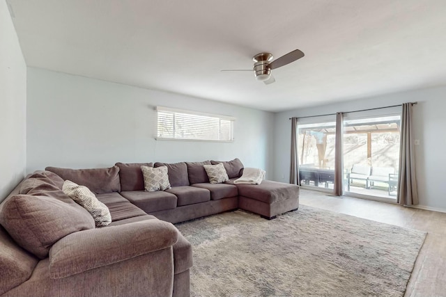 living room with hardwood / wood-style floors and ceiling fan