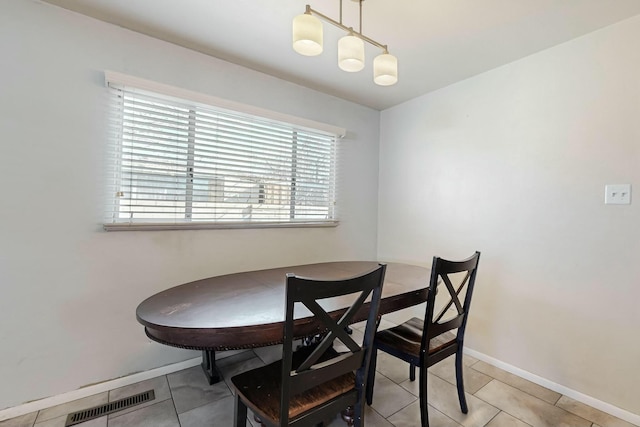 dining space with light tile patterned flooring