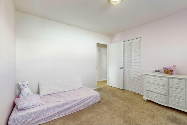 carpeted bedroom with a closet