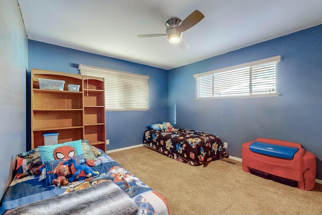 carpeted bedroom with ceiling fan