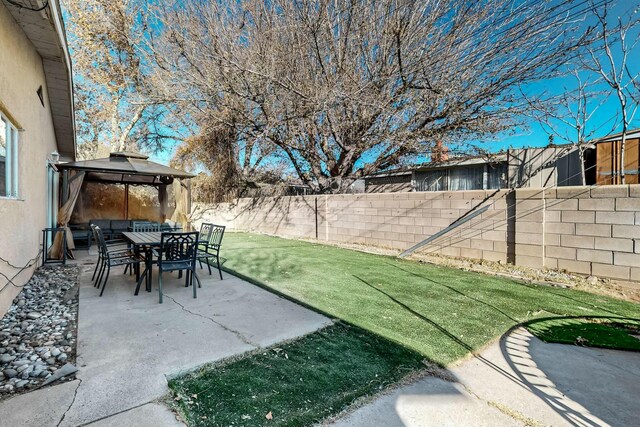 view of yard featuring a gazebo and a patio area