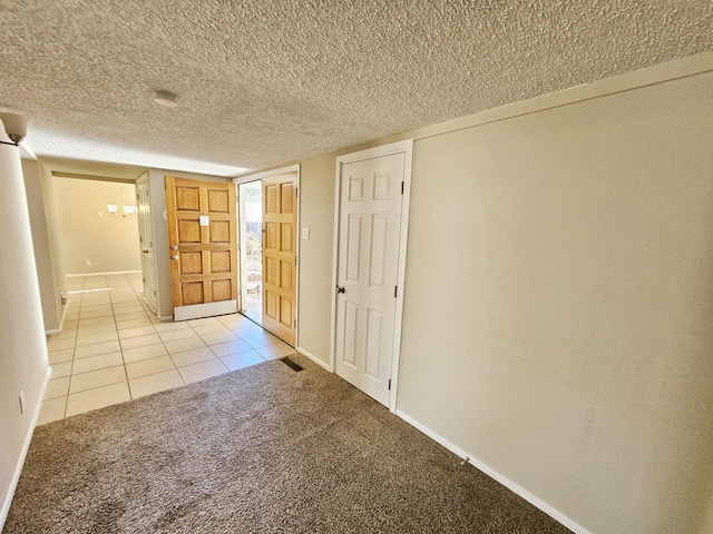 view of carpeted foyer entrance