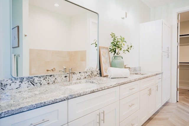 bathroom featuring vanity and parquet floors