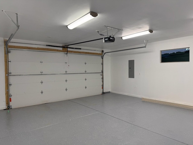 garage with electric panel and a garage door opener