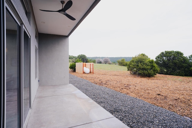 view of patio featuring ceiling fan