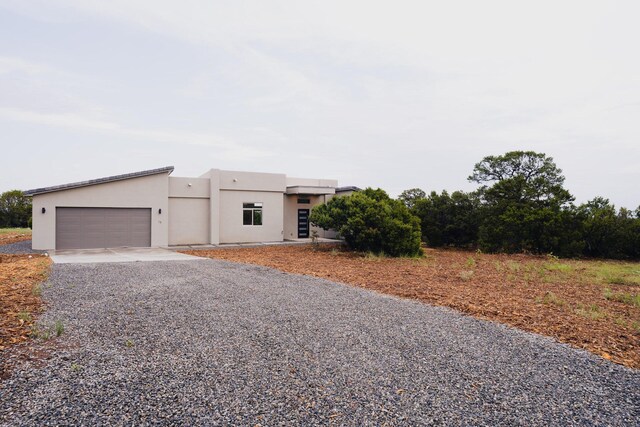 southwest-style home with a garage